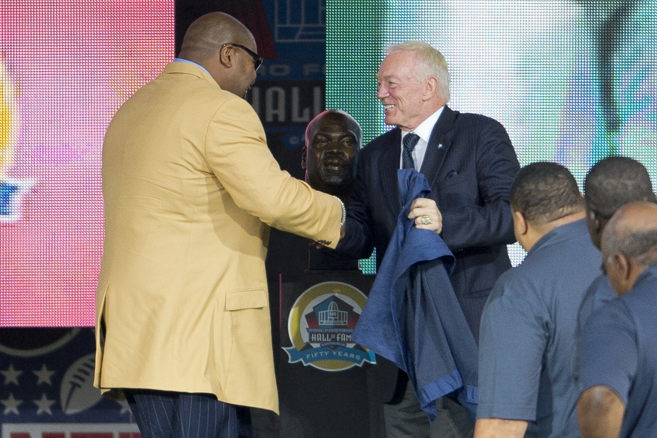 CANTON, OH - AUGUST 3: Dallas Cowboys Owner, President and General Manager, Jerry Jones (R) presents former offensive Lineman Larry Allen of the Dallas Cowboys his Hall of Fame bust during the NFL Class of 2013 Enshrinement Ceremony at Fawcett Stadium on Aug. 3, 2013 in Canton, Ohio.,Image: 167740822, License: Rights-managed, Restrictions: , Model Release: no