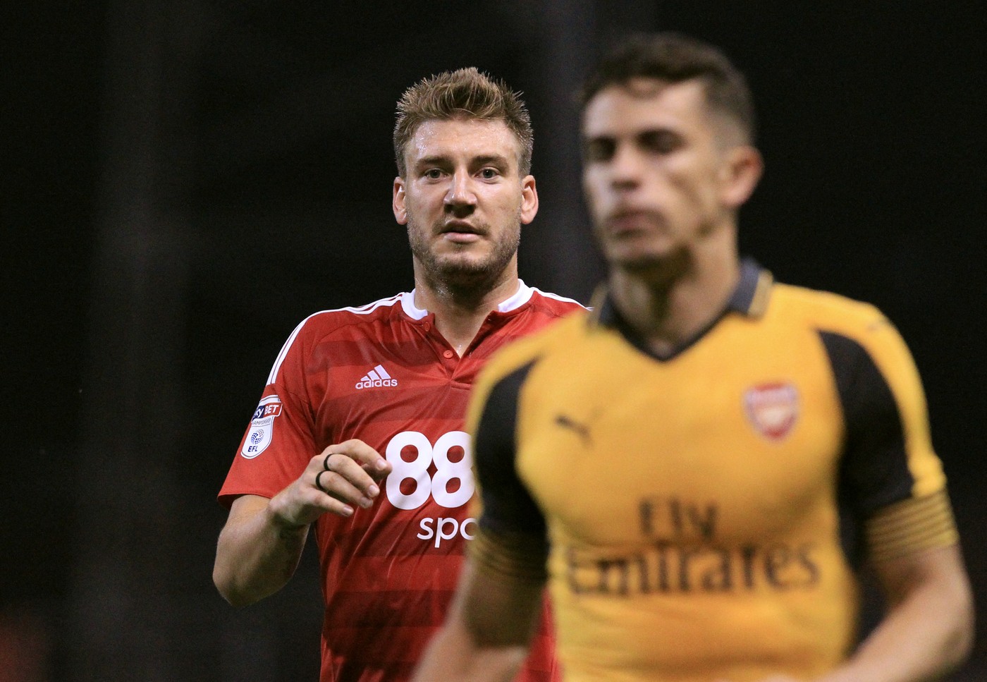 Nottingham Forest's Danish striker Nicklas Bendtner (L) vies with Arsenal's Brazilian defender Gabriel during the English League Cup third round football match between Nottingham Forest and Arsenal at The City Ground in Nottingham, central England on September 20, 2016.,Image: 300517006, License: Rights-managed, Restrictions: RESTRICTED TO EDITORIAL USE. No use with unauthorized audio, video, data, fixture lists, club/league logos or 'live' services. Online in-match use limited to 75 images, no video emulation. No use in betting, games or single club/league/player publications., Model Release: no