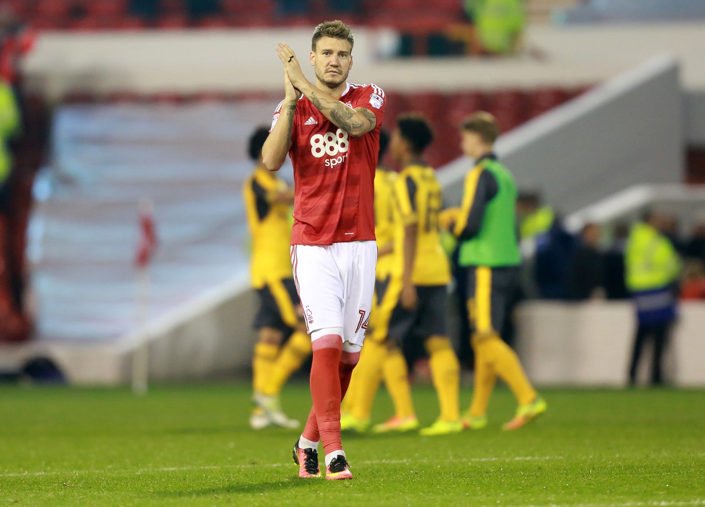 Editorial use only. No merchandising. For Football images FA and Premier League restrictions apply inc. no internet/mobile usage without FAPL license - for details contact Football Dataco
/Shutterstock (5901064v)
Nottingham Forest's Nicklas Bendtner applauds the fans at the final whistle during the EFL Cup Third Round match between Nottingham Forest and Arsenal played at The City Ground, Nottingham on 20th September 2016
Football - EFL Cup 2016/17 Third Round Nottingham Forest v Arsenal City Ground, Pavilion Rd, Nottingham, United Kingdom - 20 Sep 2016,Image: 300518098, License: Rights-managed, Restrictions: Editorial use only. No merchandising. For Football images FA and Premier League restrictions apply inc. no internet/mobile usage without FAPL license - for details contact Football Dataco, Model Release: no