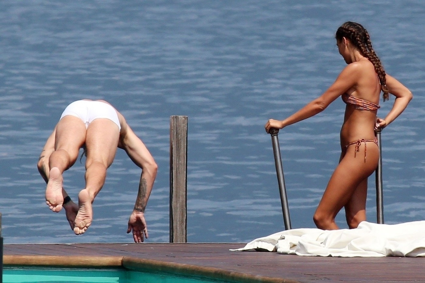 TREMEZZO, ITALY  - *EXCLUSIVE*  - Danish professional footballer Nicklas Bendtner and his girlfriend Philine Roepstorff have some fun in the sun as they enjoy a break in Tremezzo, Italy.

PICS TAKEN: 10/07/2020

BACKGRID UK 11 JULY 2020,Image: 541960657, License: Rights-managed, Restrictions: RIGHTS: WORLDWIDE EXCEPT IN ITALY, Model Release: no, Pictured: Nicklas Bendtner, Philine Roepstorff