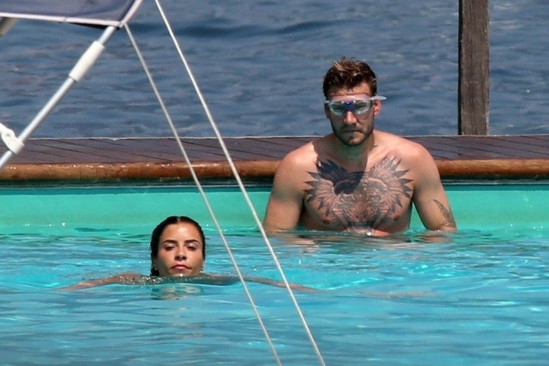 TREMEZZO, ITALY  - *EXCLUSIVE*  - Danish professional footballer Nicklas Bendtner and his girlfriend Philine Roepstorff have some fun in the sun as they enjoy a break in Tremezzo, Italy.

PICS TAKEN: 10/07/2020

BACKGRID UK 11 JULY 2020,Image: 541960675, License: Rights-managed, Restrictions: RIGHTS: WORLDWIDE EXCEPT IN ITALY, Model Release: no, Pictured: Nicklas Bendtner, Philine Roepstorff