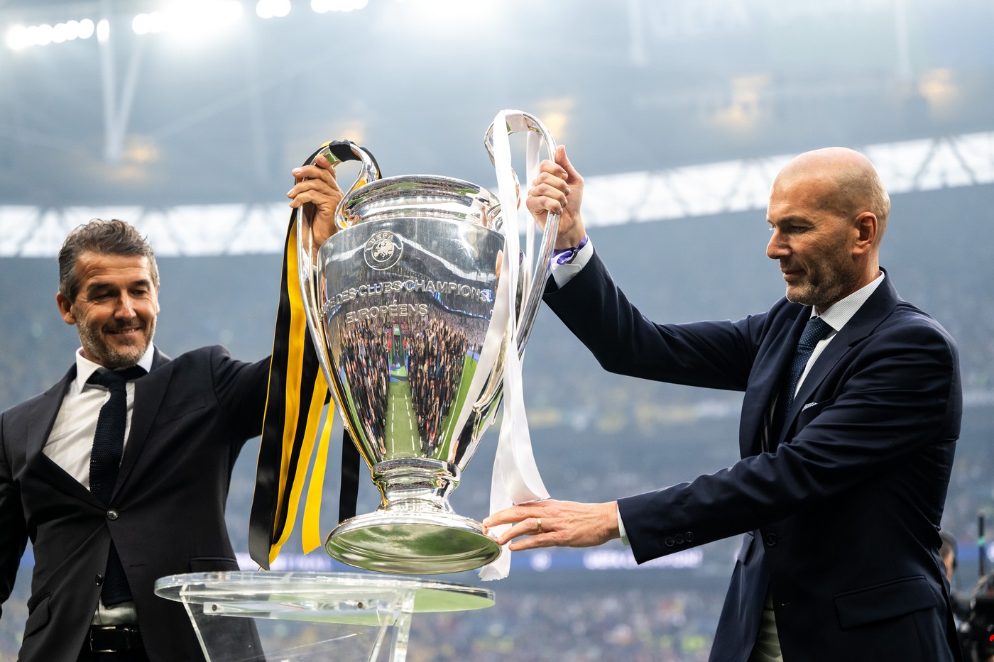 240601 Former players Karl Heinz Riedle and Zinedine Zidane carry the Champions League trophy onto the pitch ahead of the UEFA Champions League final between Dortmund and Real Madrid on June 1, 2024 in London. 
Photo: Petter Arvidson / BILDBYRĹN / kod PA / PA0818
fotboll football soccer fotball champions league final dortmund real madrid bbeng,Image: 878172753, License: Rights-managed, Restrictions: *** World Rights Except Austria, Denmark, Finland, Norway, and  Sweden *** AUTOUT DNKOUT FINOUT NOROUT SWEOUT, Model Release: no