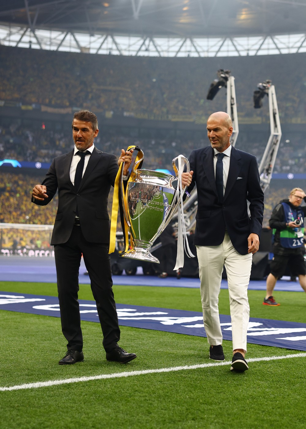 June 1, 2024, London: London, England, 1st June 2024. Karl-Heinz Riedle and Zinedine Zidane present the UEFA Champions League Trophy prior to the UEFA Champions League final match at Wembley Stadium, London.,Image: 878175567, License: Rights-managed, Restrictions: * United Kingdom Rights OUT *, Model Release: no