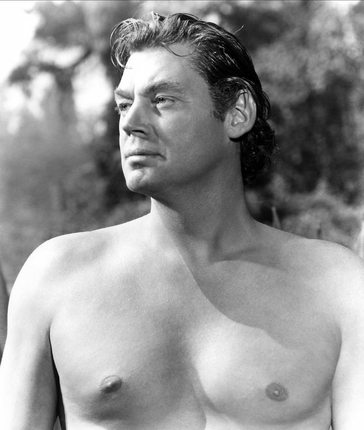 Johnny Weissmuller  Characters: Tarzan Film: Tarzan And The Leopard Woman (USA 1946)  Director: Kurt Neumann 08 January 1946     Date: 08-Jan-1946,Image: 418237854, License: Rights-managed, Restrictions: Please use full Credit line: Mary Evans/AF Archive. **Warning** This Photograph is for editorial use only and is the copyright of Rko and/or the Photographer assigned by the Film or Production Company & can only be reproduced by publications in conjunc, Model Release: no
