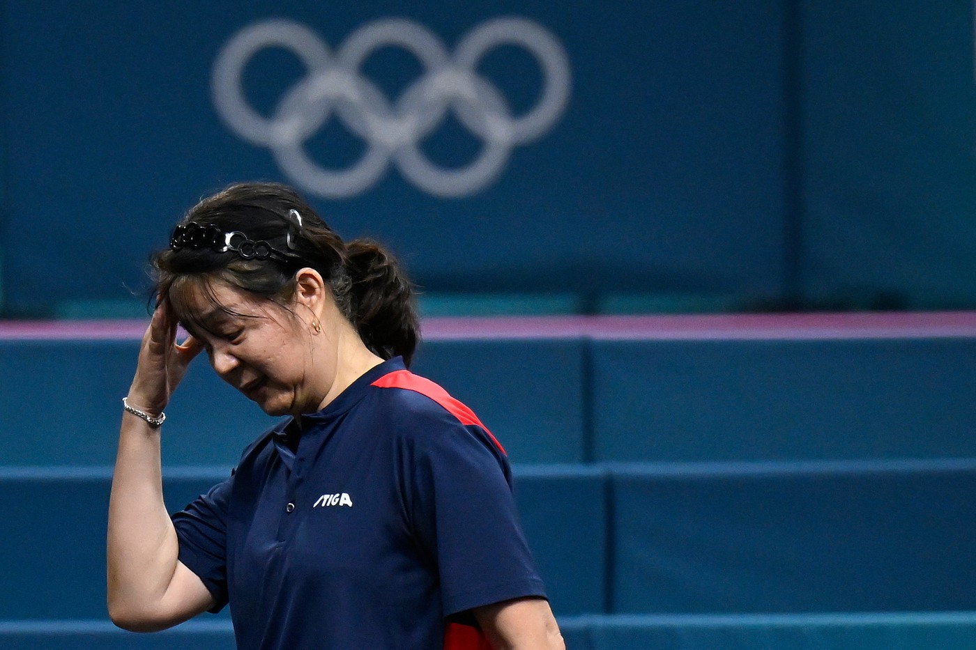 Chile's Zhiying Zeng reacts as she plays against Lebanon's Mariana Sahakian during their women's table tennis singles preliminary round at the Paris 2024 Olympic Games at the South Paris Arena in Paris on July 27, 2024.,Image: 893033249, License: Rights-managed, Restrictions: , Model Release: no