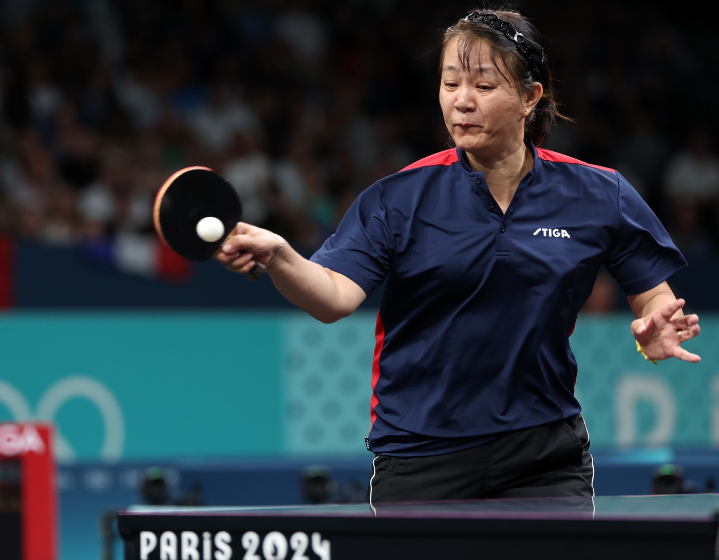 PARIS, July 27, 2024  -- Zeng Zhiying of Chile competes during women's singles preliminary round table tennis match against Mariana Sahakian of Lebanon at the Paris 2024 Olympic Games in Paris, France, on July 27, 2024.,Image: 893133610, License: Rights-managed, Restrictions: , Model Release: no