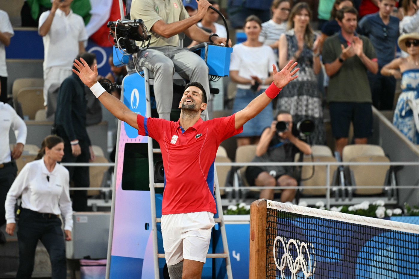 Serbia's Novak Djokovic celebrates beating Italy's Lorenzo Musetti during their men's singles semi-final tennis match on Court Philippe-Chatrier at the Roland-Garros Stadium during the Paris 2024 Olympic Games, in Paris on August 2, 2024.,Image: 895429219, License: Rights-managed, Restrictions: , Model Release: no