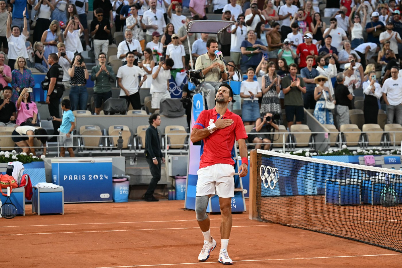 Serbia's Novak Djokovic celebrates beating Italy's Lorenzo Musetti during their men's singles semi-final tennis match on Court Philippe-Chatrier at the Roland-Garros Stadium during the Paris 2024 Olympic Games, in Paris on August 2, 2024.,Image: 895430504, License: Rights-managed, Restrictions: , Model Release: no