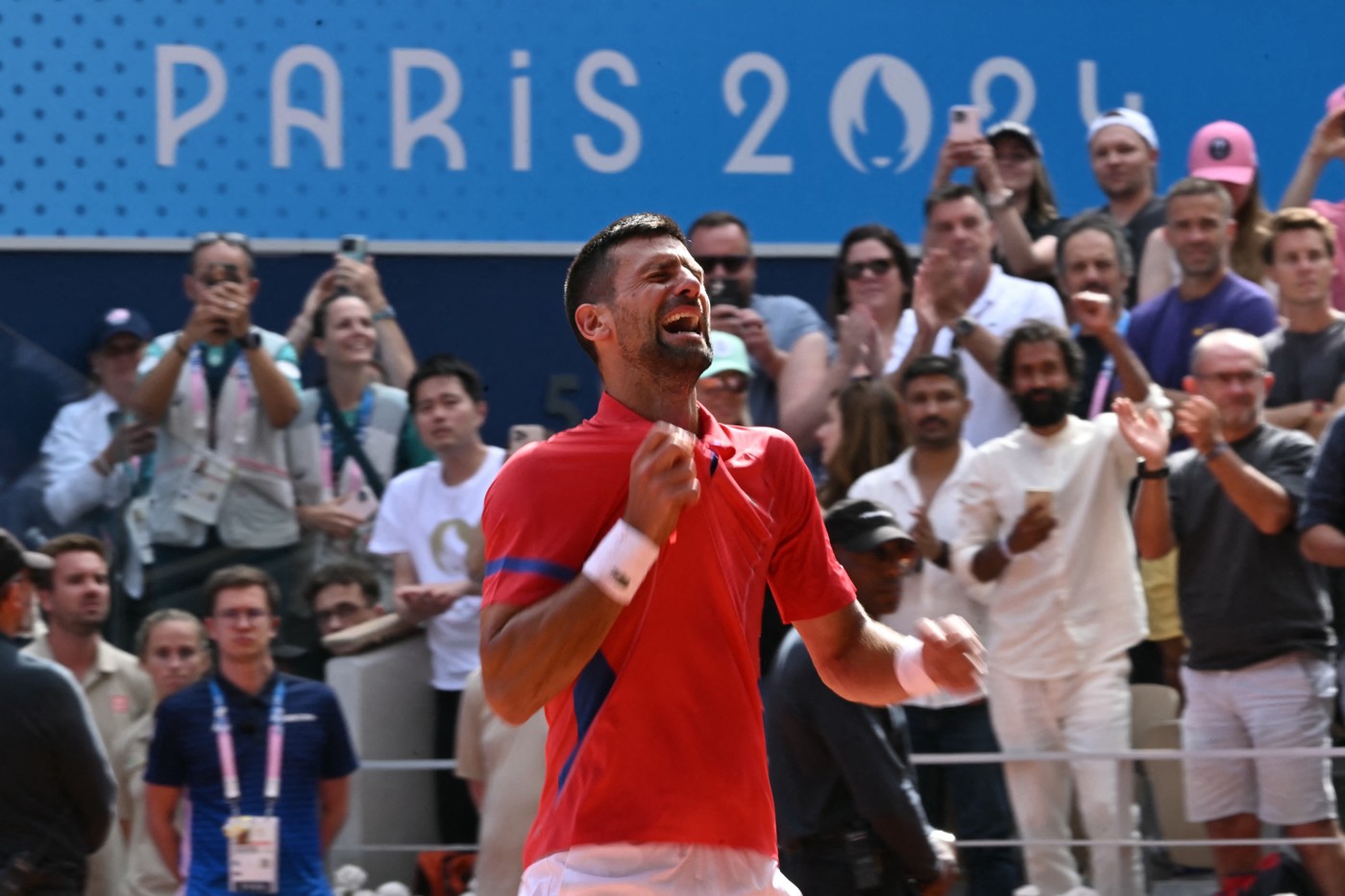 Serbia's Novak Djokovic reacts to beating Spain's Carlos Alcaraz in their men's singles final tennis match on Court Philippe-Chatrier at the Roland-Garros Stadium during the Paris 2024 Olympic Games, in Paris on August 4, 2024.,Image: 895899779, License: Rights-managed, Restrictions: , Model Release: no