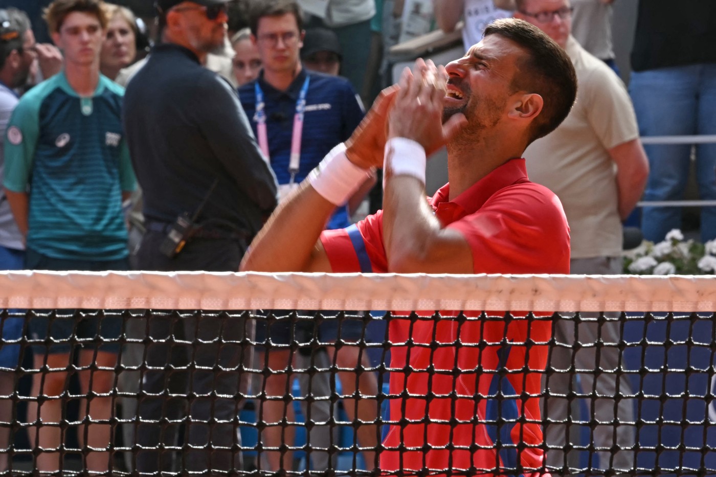 Serbia's Novak Djokovic reacts to beating Spain's Carlos Alcaraz in their men's singles final tennis match on Court Philippe-Chatrier at the Roland-Garros Stadium during the Paris 2024 Olympic Games, in Paris on August 4, 2024.,Image: 895899804, License: Rights-managed, Restrictions: , Model Release: no