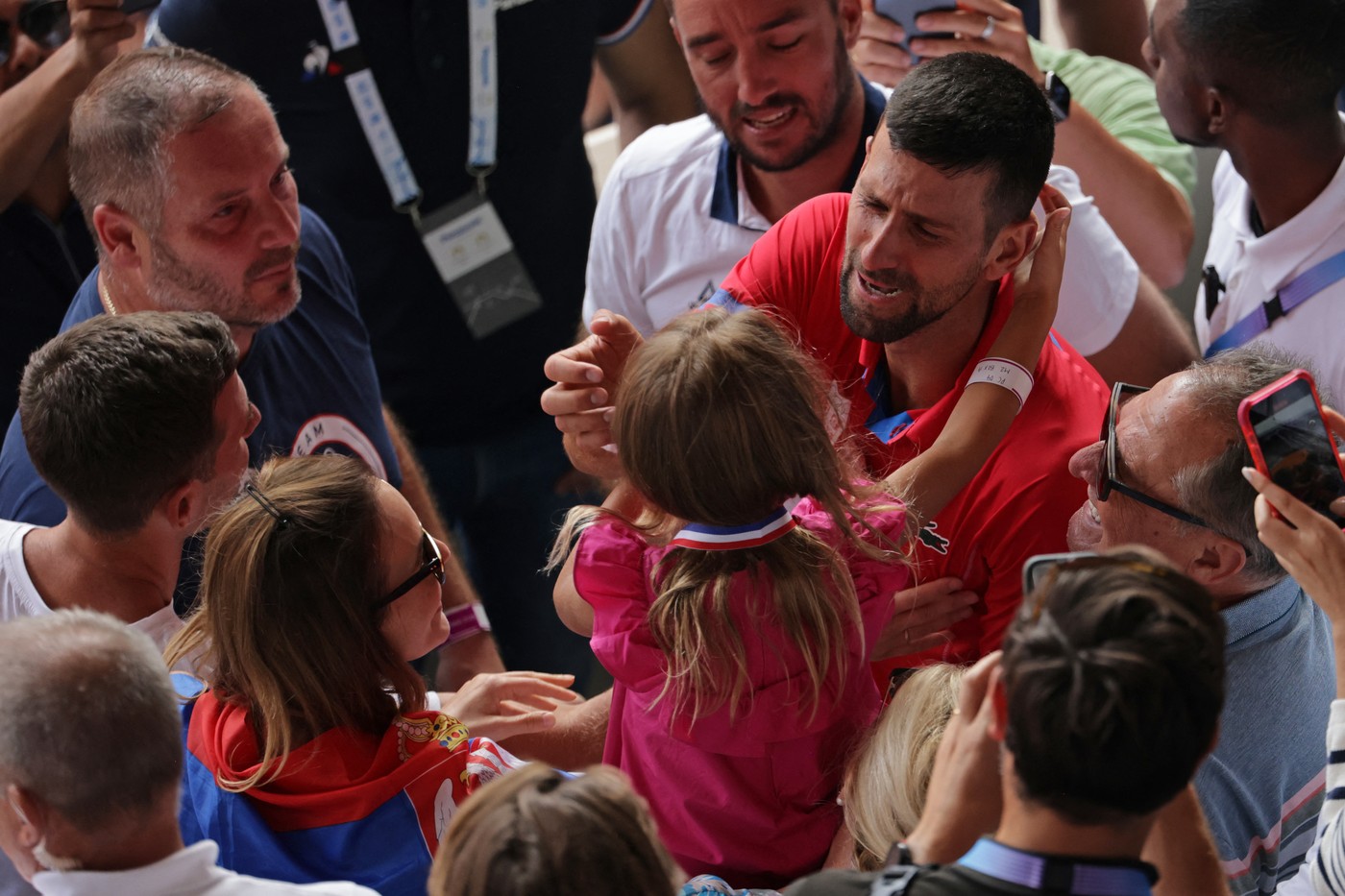Serbia's Novak Djokovic celebrates with his family in the crowd after beating Spain's Carlos Alcaraz in their men's singles final tennis match on Court Philippe-Chatrier at the Roland-Garros Stadium during the Paris 2024 Olympic Games, in Paris on August 4, 2024.,Image: 895907503, License: Rights-managed, Restrictions: , Model Release: no