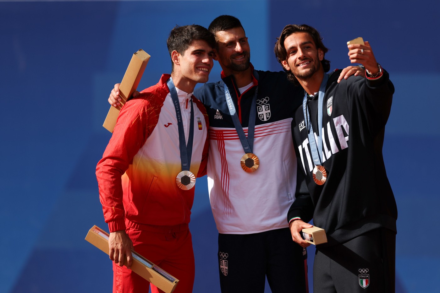 Silver Medalist Carlos Alcaraz of Spain (left), Gold Medalist Novak Djokovic of Serbia (centre) and Bronze Medalist Lorenzo Musetti (right)
Paris 2024 Olympic Games, Day Nine, Paris, France - 04 Aug 2024,Image: 895908936, License: Rights-managed, Restrictions: , Model Release: no