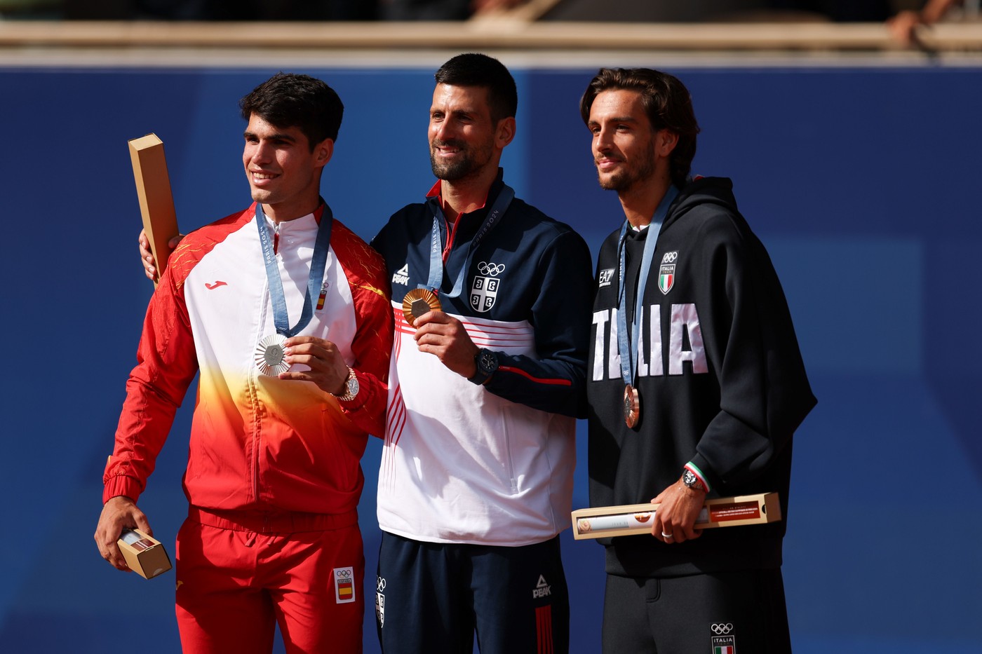 Silver Medalist Carlos Alcaraz of Spain (left), Gold Medalist Novak Djokovic of Serbia (centre) and Bronze Medalist Lorenzo Musetti (right)
Paris 2024 Olympic Games, Day Nine, Paris, France - 04 Aug 2024,Image: 895908943, License: Rights-managed, Restrictions: , Model Release: no
