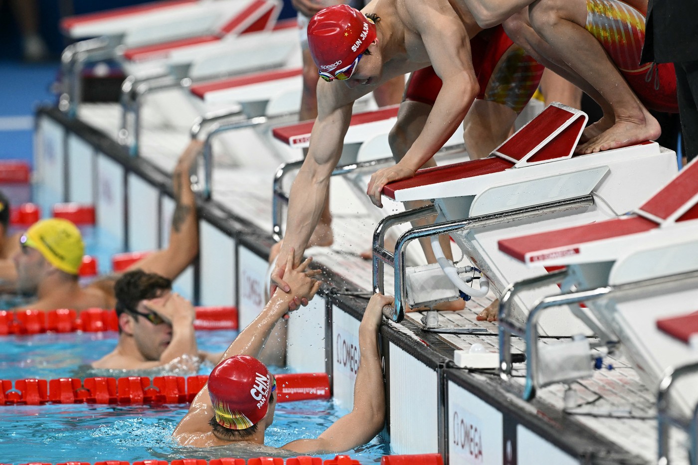 China's Pan Zhanle (L) and China's Sun Jiajun (R) celebrate winning the final of the men's 4x100m medley relay final swimming event during the Paris 2024 Olympic Games at the Paris La Defense Arena in Nanterre, west of Paris, on August 4, 2024.,Image: 895952697, License: Rights-managed, Restrictions: , Model Release: no