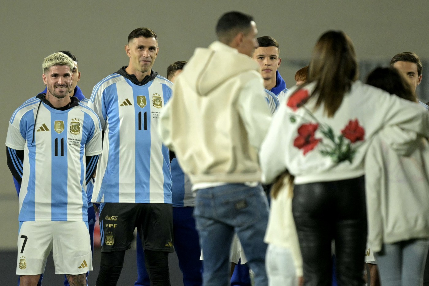 Argentina's midfielder Rodrigo de Paul (L) and goalkeeper Emiliano Martinez (2nd L) take part in a tribute to Argentina's midfielder Angel Di Maria (C) after retiring from the Argentine national team before the 2026 FIFA World Cup South American qualifiers football match between Argentina and Chile at the Mas Monumental stadium in Buenos Aires on September 5, 2024.,Image: 905138906, License: Rights-managed, Restrictions: , Model Release: no