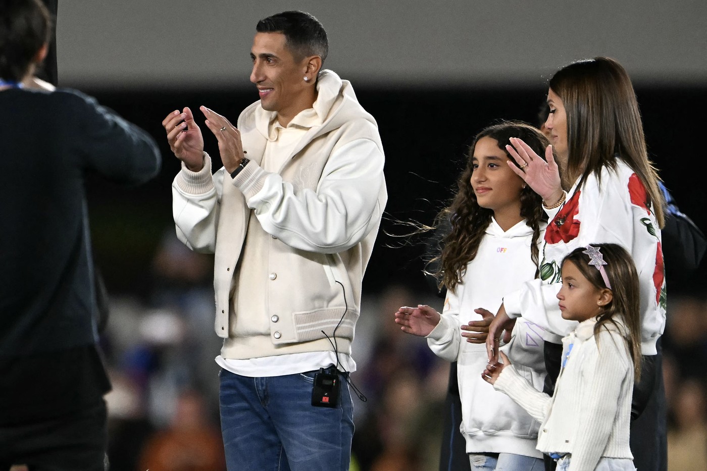 Argentina's midfielder Angel Di Maria (L), accompanied by his wife Jorgelina Cardoso (R) and their daughters Mia (3rd L) and Pia, applauds during a tribute after retiring from the Argentine national team before the 2026 FIFA World Cup South American qualifiers football match between Argentina and Chile at the Mas Monumental stadium in Buenos Aires on September 5, 2024.,Image: 905141383, License: Rights-managed, Restrictions: , Model Release: no