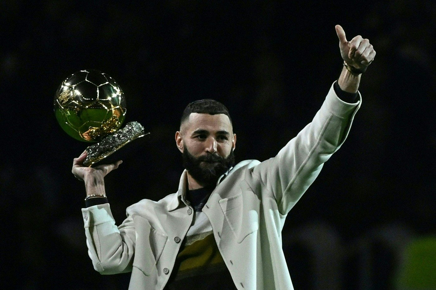 Real Madrid's French forward Karim Benzema poses on the pitch with his Ballon d'Or trophy at half time of the French L1 football match between Olympique Lyonnais (OL) and OGC Nice at The Groupama Stadium in Decines-Charpieu, central-eastern France, on November 11, 2022.,Image: 736849815, License: Rights-managed, Restrictions: ALTERNATIVE CROP, Model Release: no