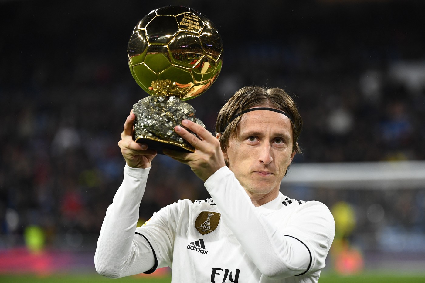 Real Madrid's Croatian midfielder Luka Modric poses with his Ballon d'Or trophy before the Spanish League football match between Real Madrid and Rayo Vallecano at the Santiago Bernabeu stadium in Madrid on December 15, 2018.,Image: 402913039, License: Rights-managed, Restrictions: , Model Release: no