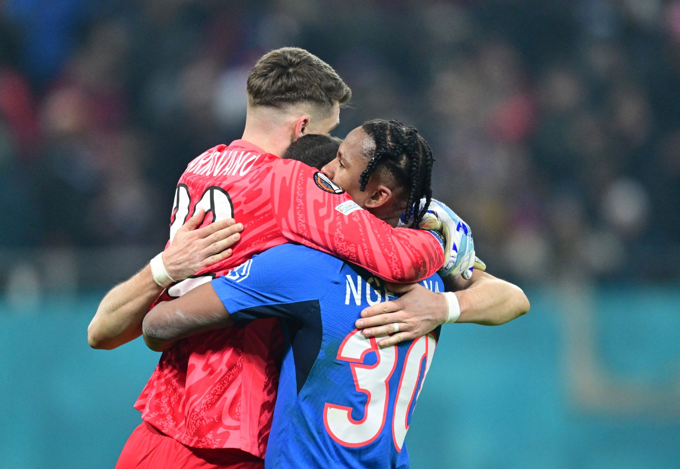 FCSB's South African defender #30 Siyabonga Ngezana (R), FCSB's Romanian goalkeeper #32 Stefan Tarnovanu (L) and other FCSB's Romanian players celebrate after winning 2-0 the UEFA Europa League knockout round play-off 2nd leg football match between FC Steaua Bucharest and PAOK FC in Bucharest, Romania, on February 20, 2025.,Image: 966576318, License: Rights-managed, Restrictions: , Model Release: no