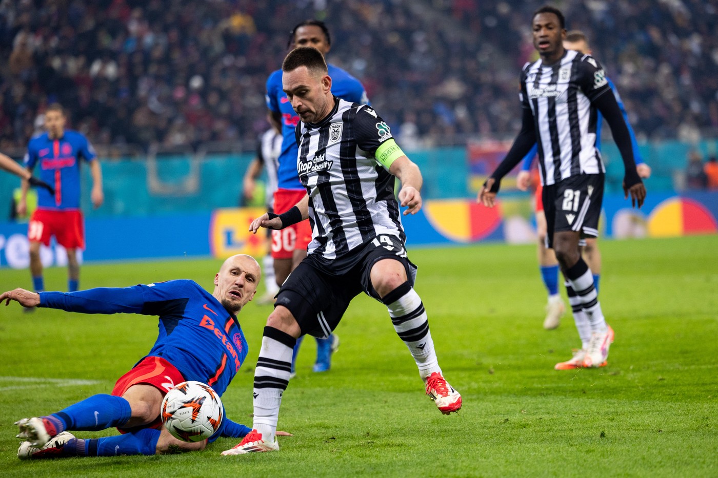 Vlad Chiriches of FCSB tackling Andrija Zivkovic of PAOK FC during the UEFA Europa League, League phase football match between FCBS and Manchester United on 30 January 2025 at National Arena in Bucharest, Romania - Photo Mihnea Tatu / Lightspeed Images / DPPI,Image: 966578060, License: Rights-managed, Restrictions: Hungary Out, Model Release: no